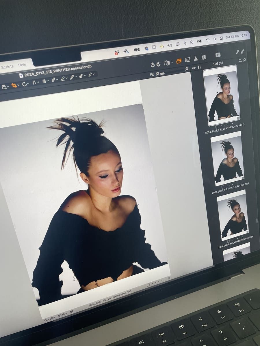 Josephine Højbjerg poses in a black off-shoulder top with a stylish hairstyle.